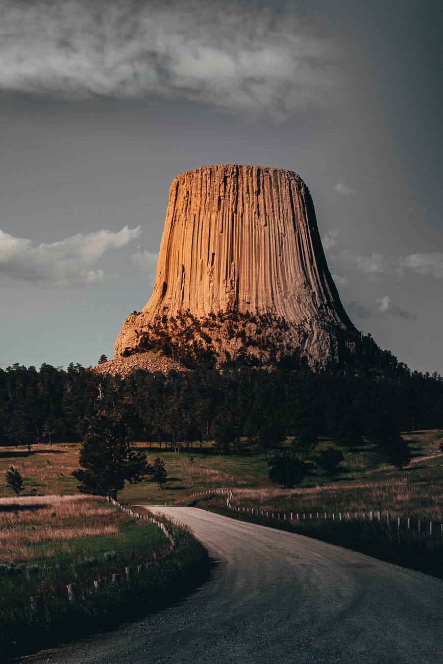 green trees near rock formation