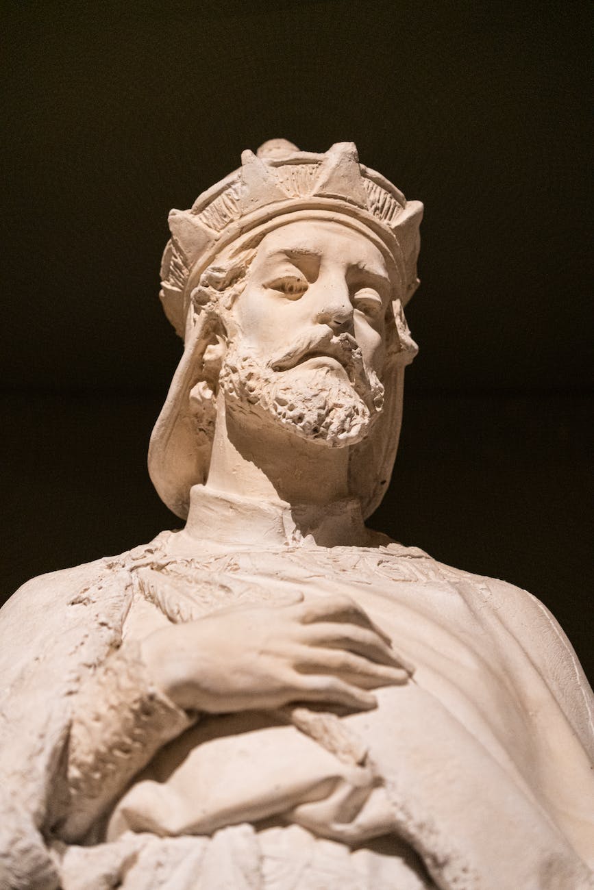 marble sculpture of king on black backg